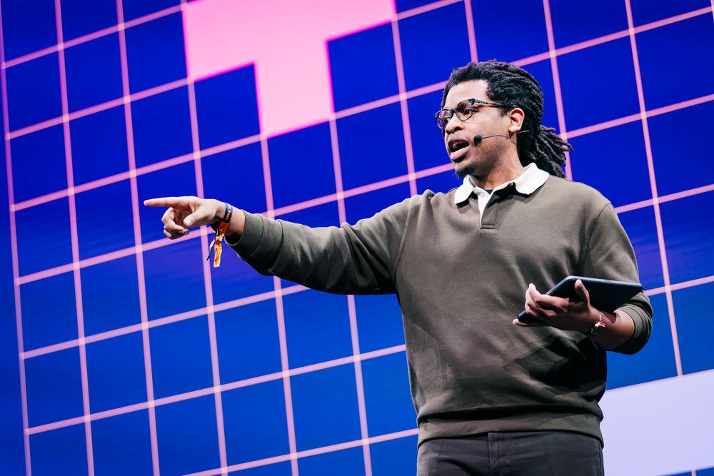 Terrance pointing into the audience from the DPW Amsterdam stage, tablet in hand